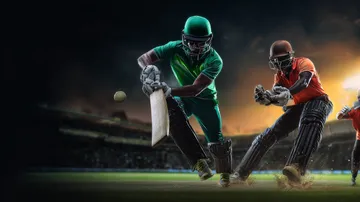 A man celebrating a winning moment on his laptop while gaming symbols float around him, capturing the excitement of JAYA games.