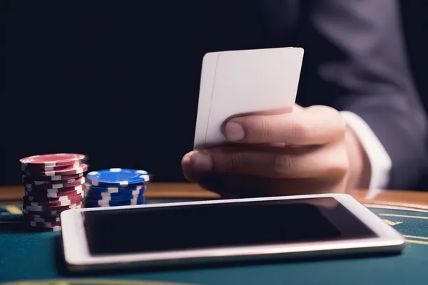 A confident dealer surrounded by casino chips inviting players to access their JAYA account, reflecting quick and easy login options.