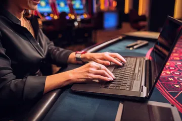 A laptop glowing with a bright login prompt in a minimalistic setup, symbolizing the protected access system at JAYA.